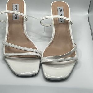 White Steve Madden heels.